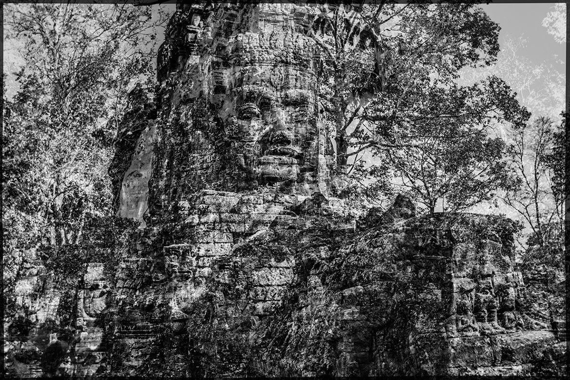 A temple guard in the jungle of Cambodia. The striking face should probably have a deterrent effect many years ago.